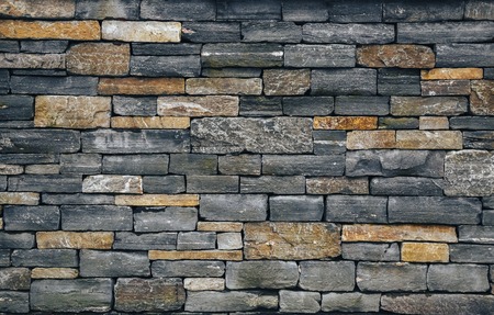 Stone wall, brick rock texture, stone texture. Different color stones. Grey and warm background