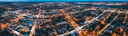 Brest, Belarus. Cityscape Skyline In Evening Illuminations. Night Birds-eye View Of Brest Market And Pedestrian Sovietskaya Street. Panorama, Panoramic View